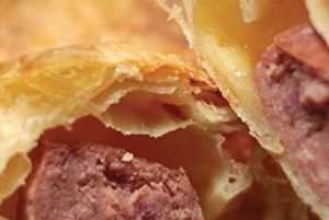 Savory pastry bites with sausage and gouda